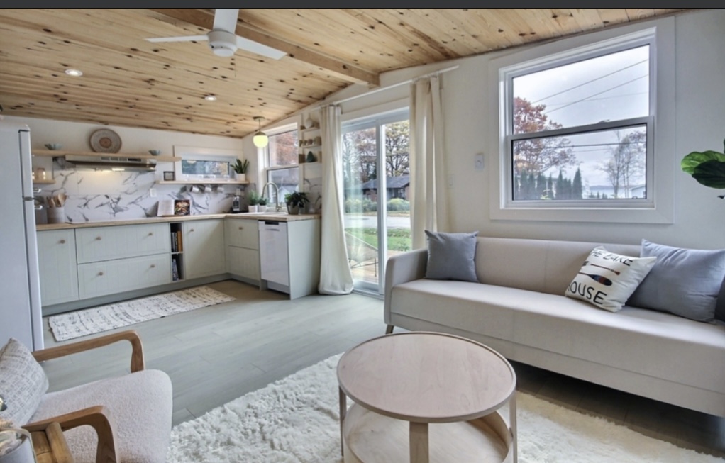 Completed home renovation with a wood ceiling, bright kitchen and comfortable living area